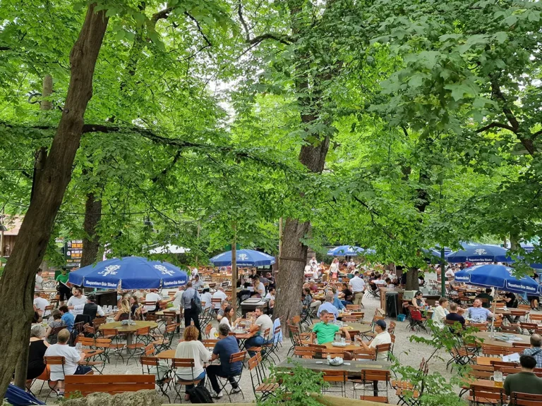 Augustinerkeller beer garden in Munich with guests seated under chestnut trees