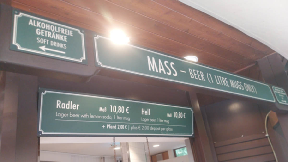 Beer garden Mass counter showing Radler and Hell prices with Pfand deposit sign