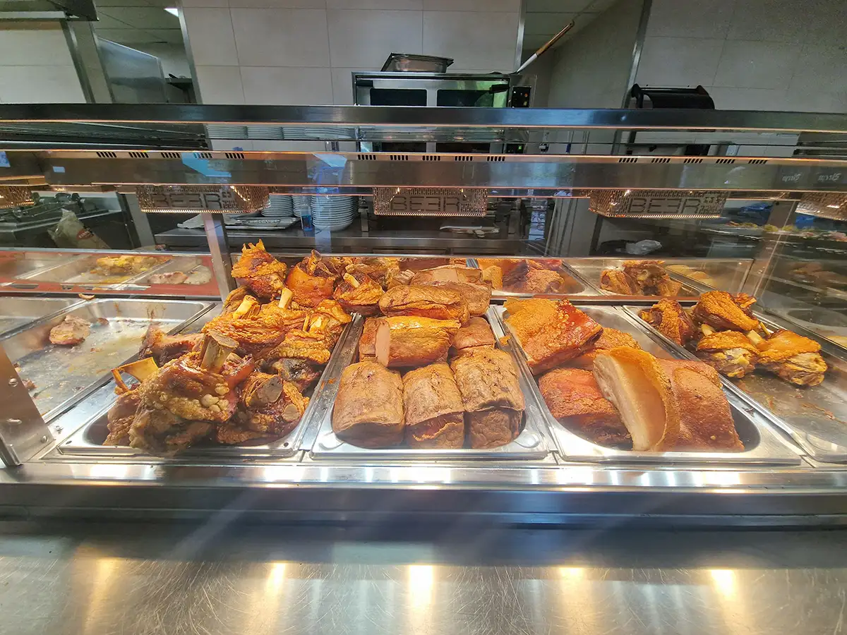 Roasted Bavarian pork and meat cuts at a Munich beer garden food counter