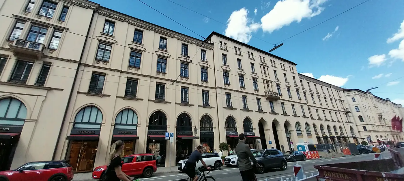 Maximilianstrasse in Munich with luxury storefronts and historic buildings