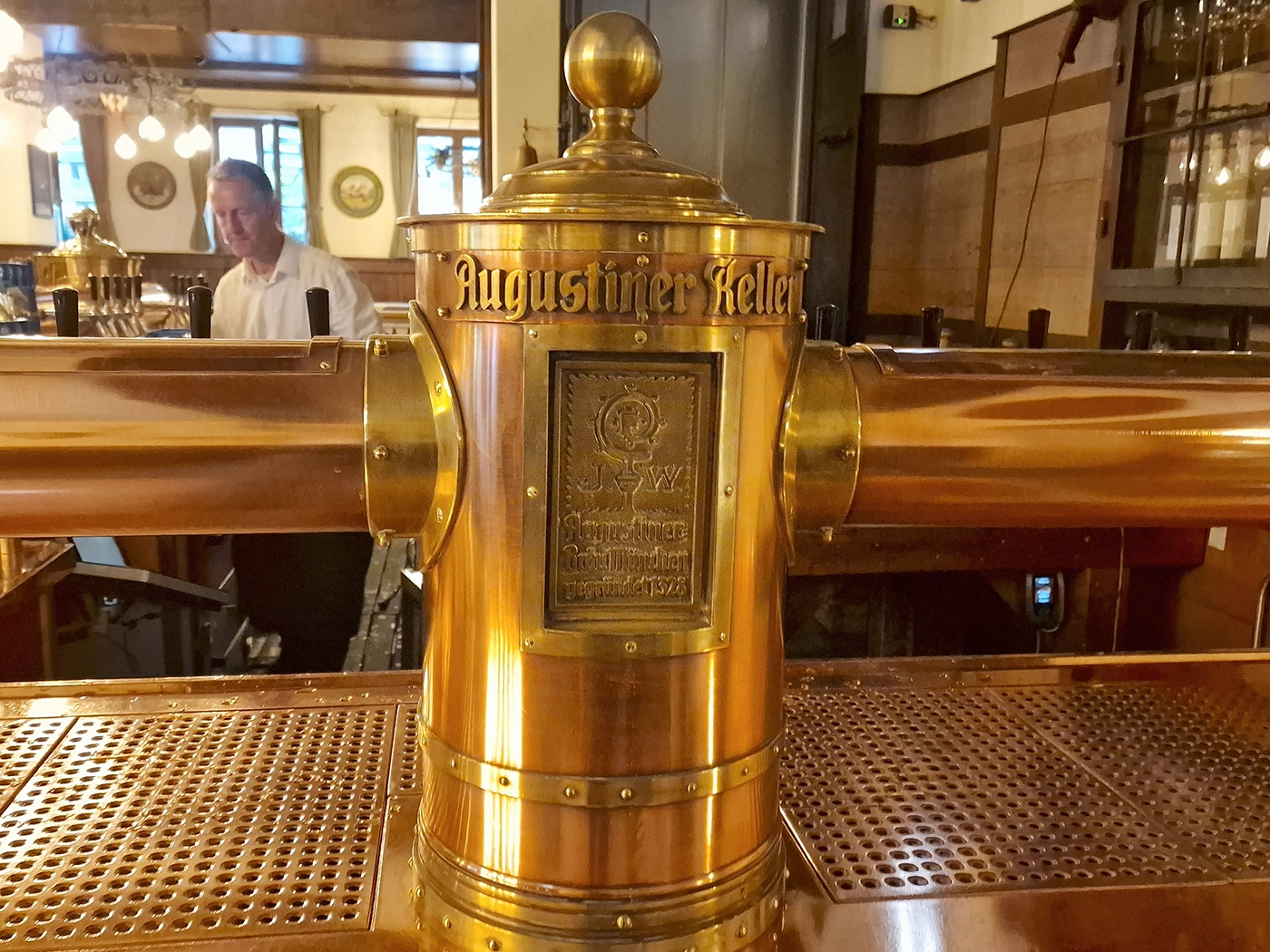 Historic brass beer tap marked Augustiner Keller in Munich
