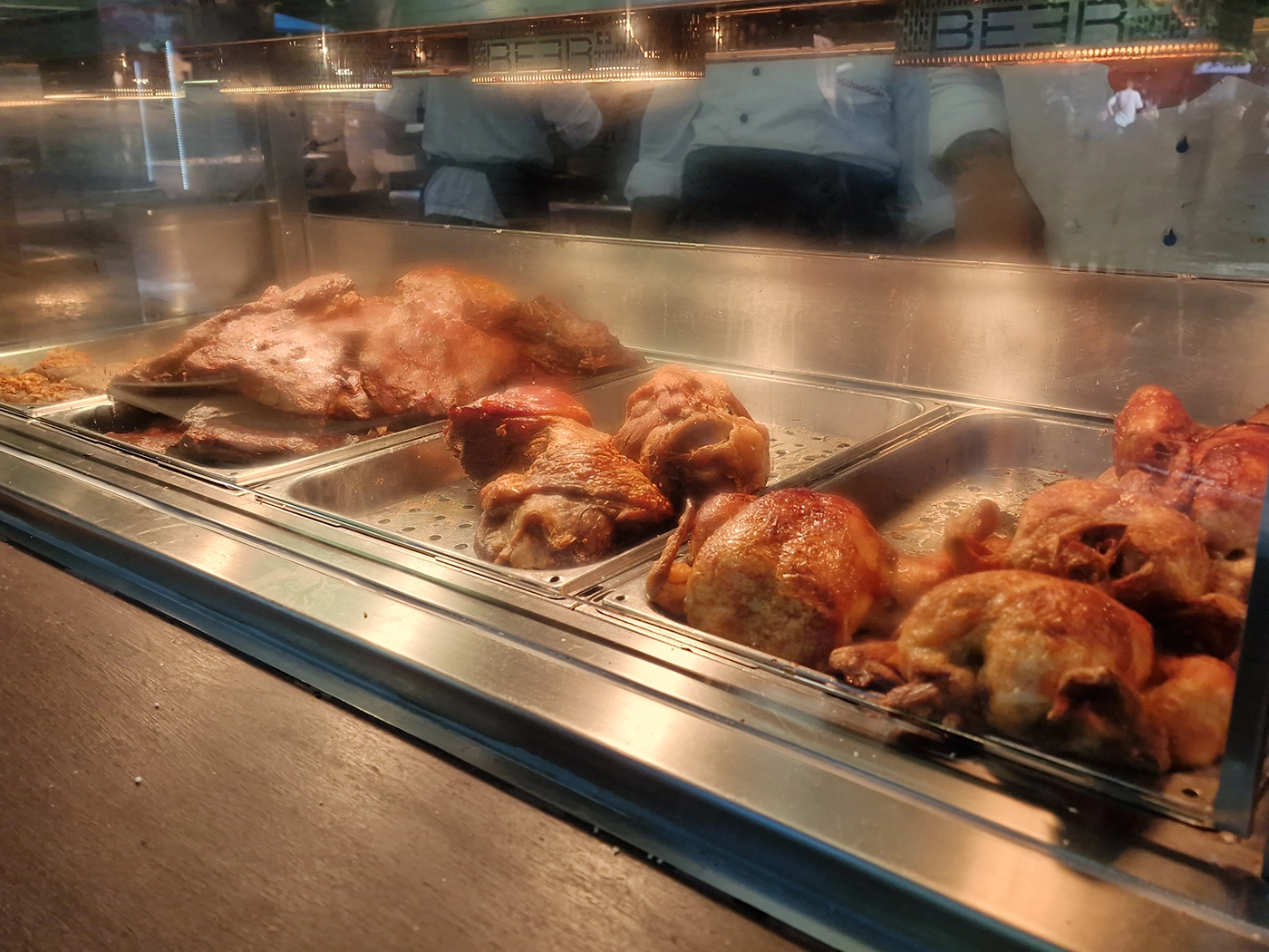 Roast chickens displayed at a Munich beer garden food counter