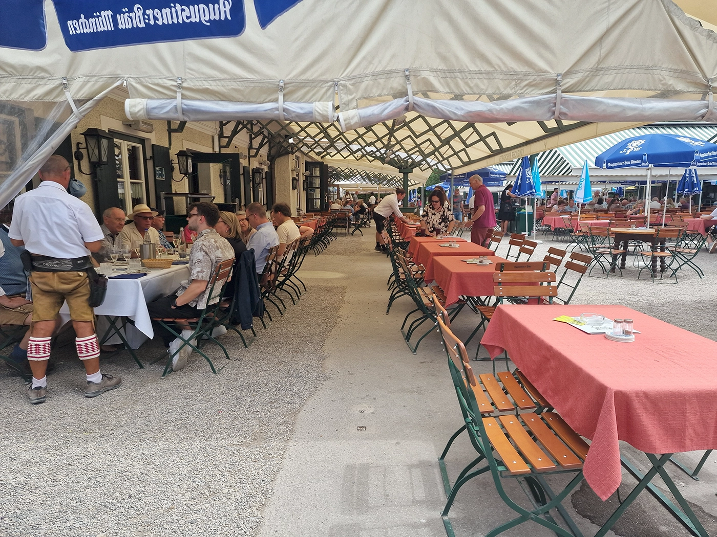 Served dining section with tablecloths and waitstaff at Hirschgarten in Munich