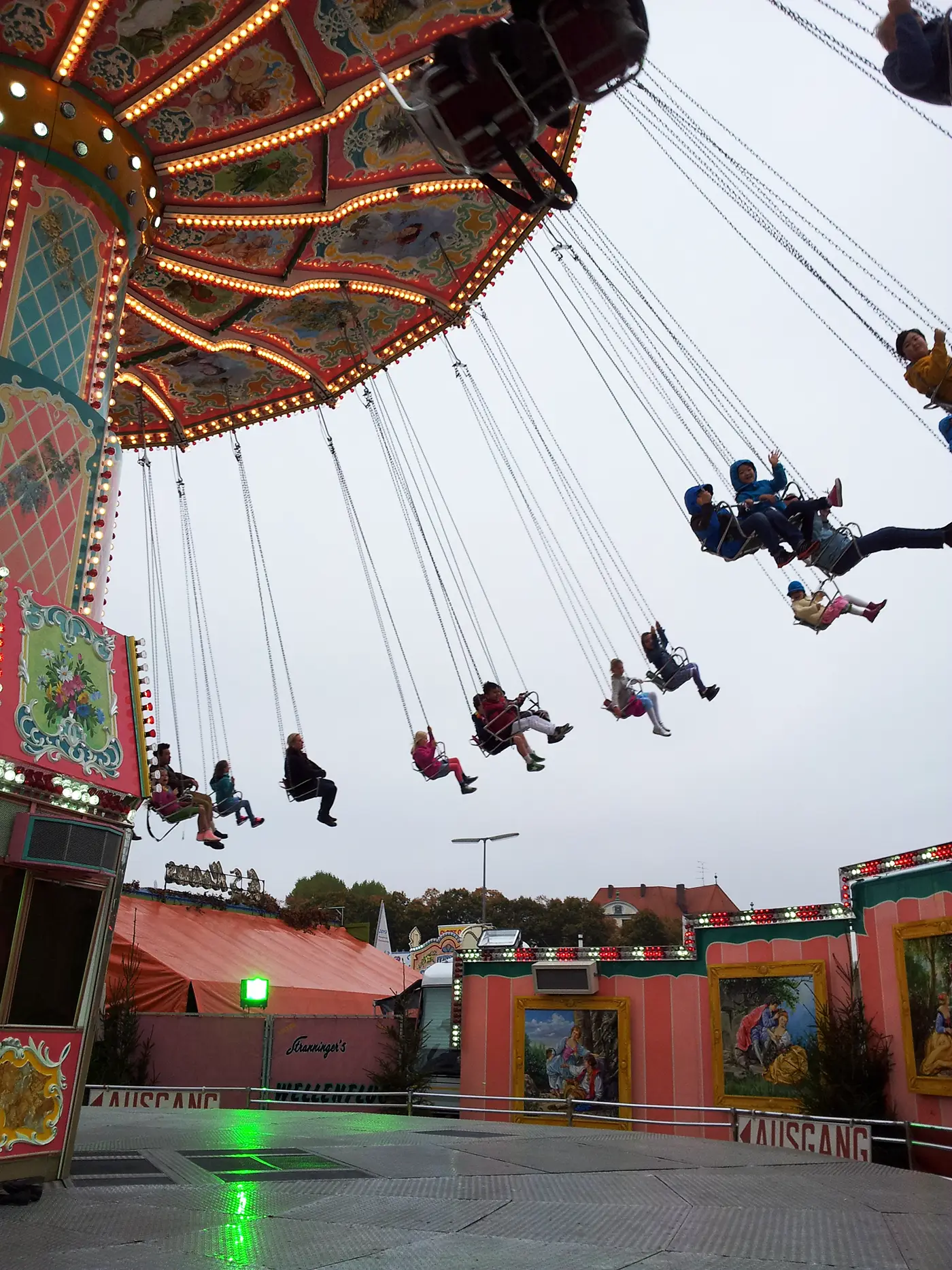 Swing carousel ride at Oktoberfest in Munich during a daytime fairground visit