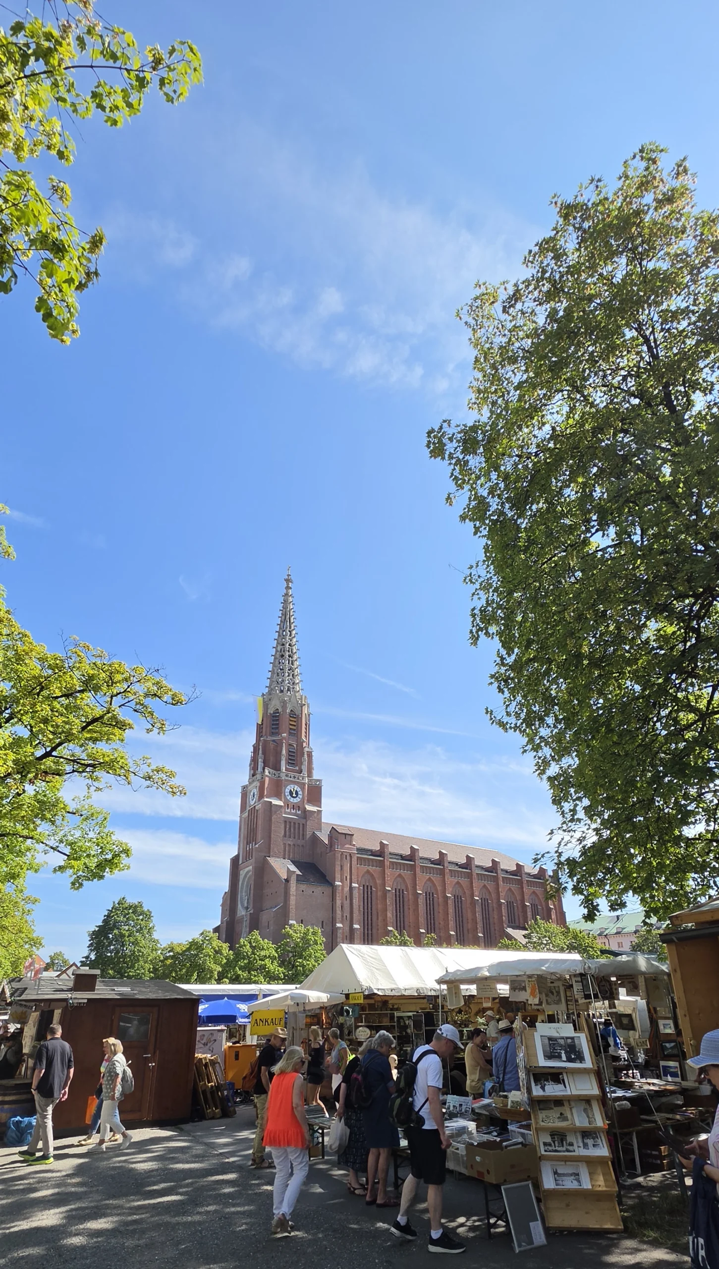 Auer Jakobidult market stalls with Mariahilfkirche in Munich in July 2026