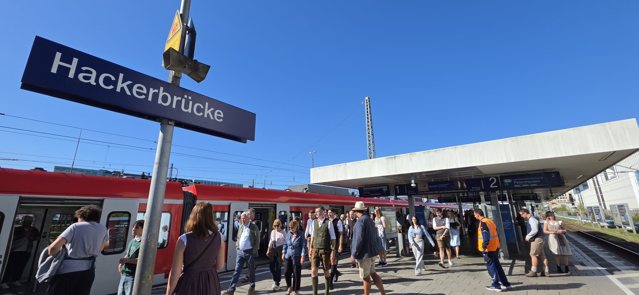 Visitors arriving at Hackerbrücke station for Oktoberfest opening day