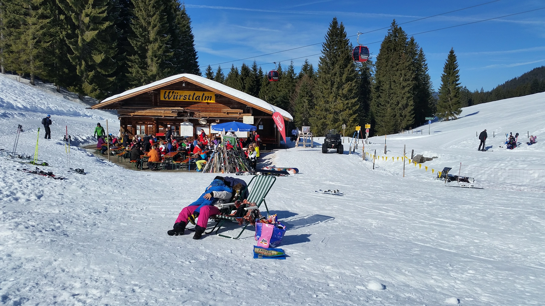 Outdoor seating and family rest area beside the ski slopes at Winklmoosalm