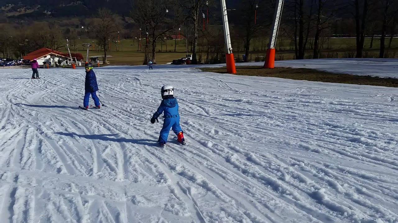 Two brothers practising skiing together at Draxllifte in Lenggries
