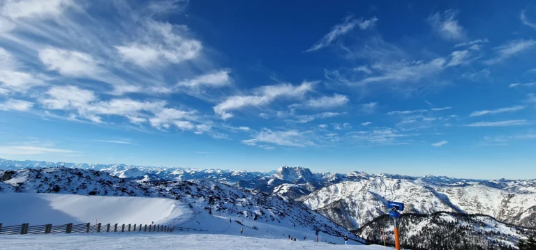 Wide Alpine ski landscape near Munich with snow-covered mountains and open pistes